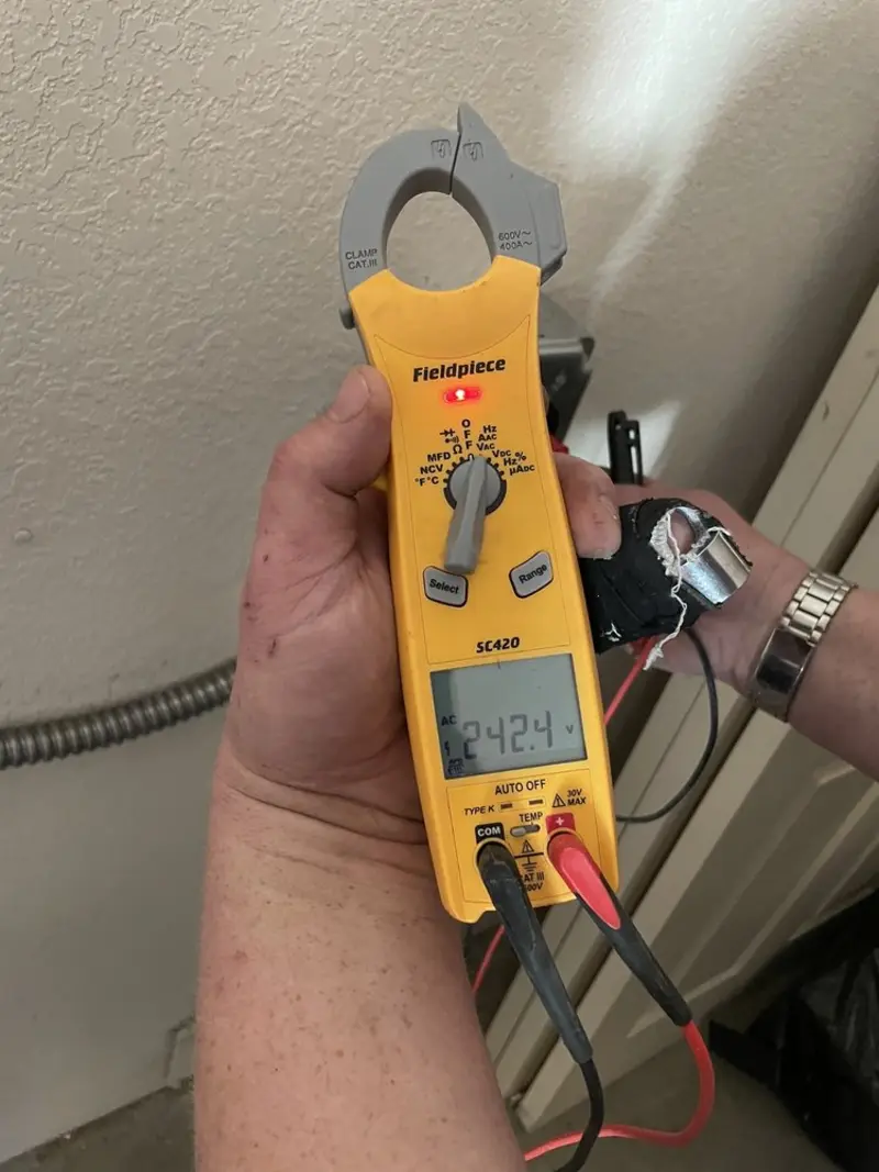 Voltage testing with clamp meter during Outlet Installation in Cedar City
